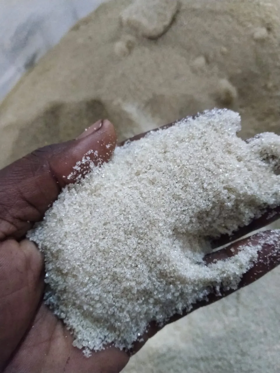 A handful of white sugar crystals
