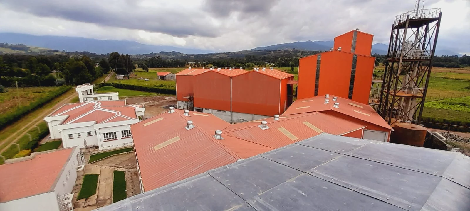 Ranges Sugar Holdings factory buildings in the green countryside of Miharati, Nyandarua